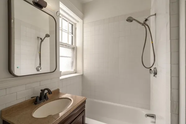 a bathroom with a sink and a window