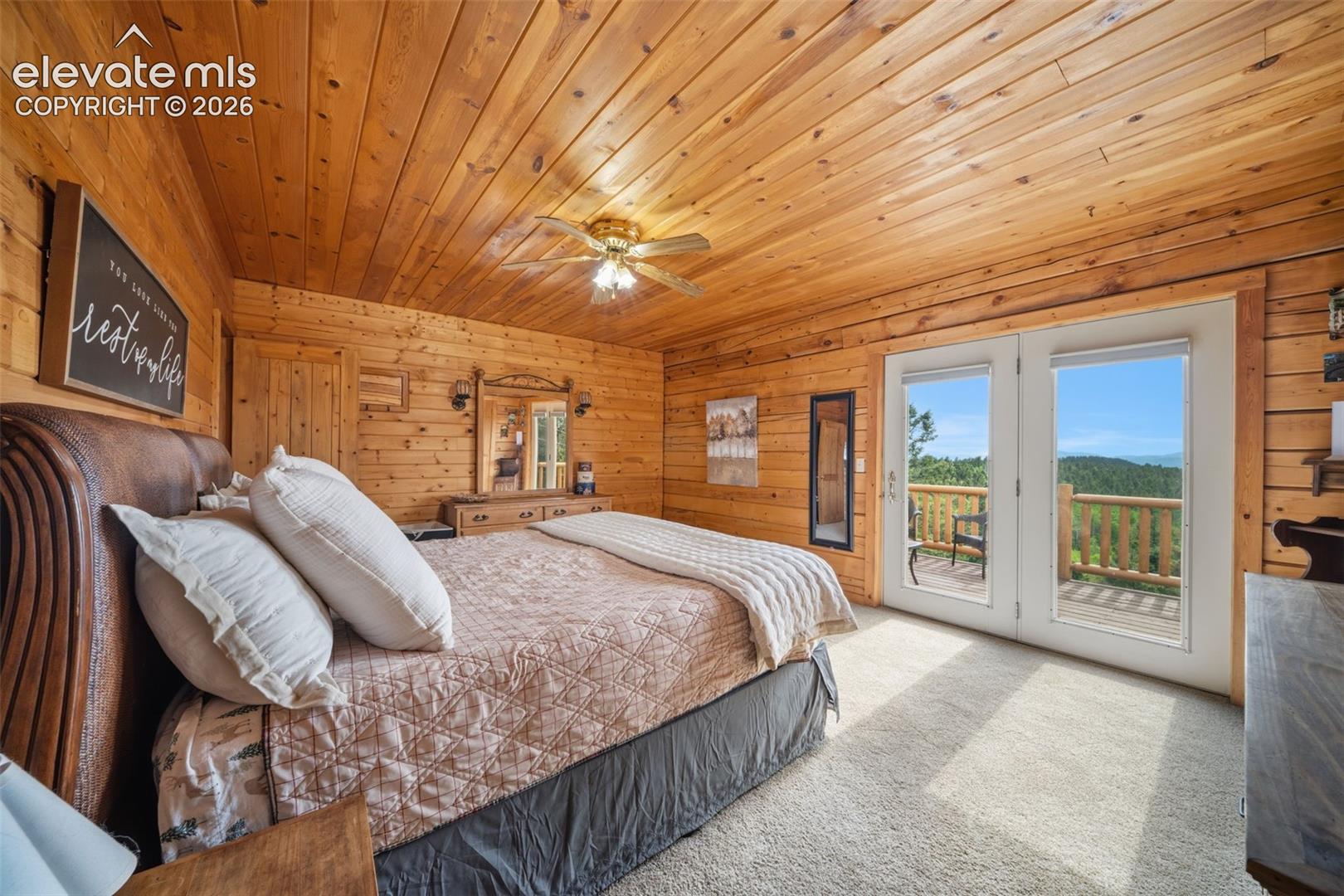 4269 County Road 51 Road Divide, CO 80814 - Photo 11 of 39 Main level primary bedroom with walk out to back deck and the view are stunning