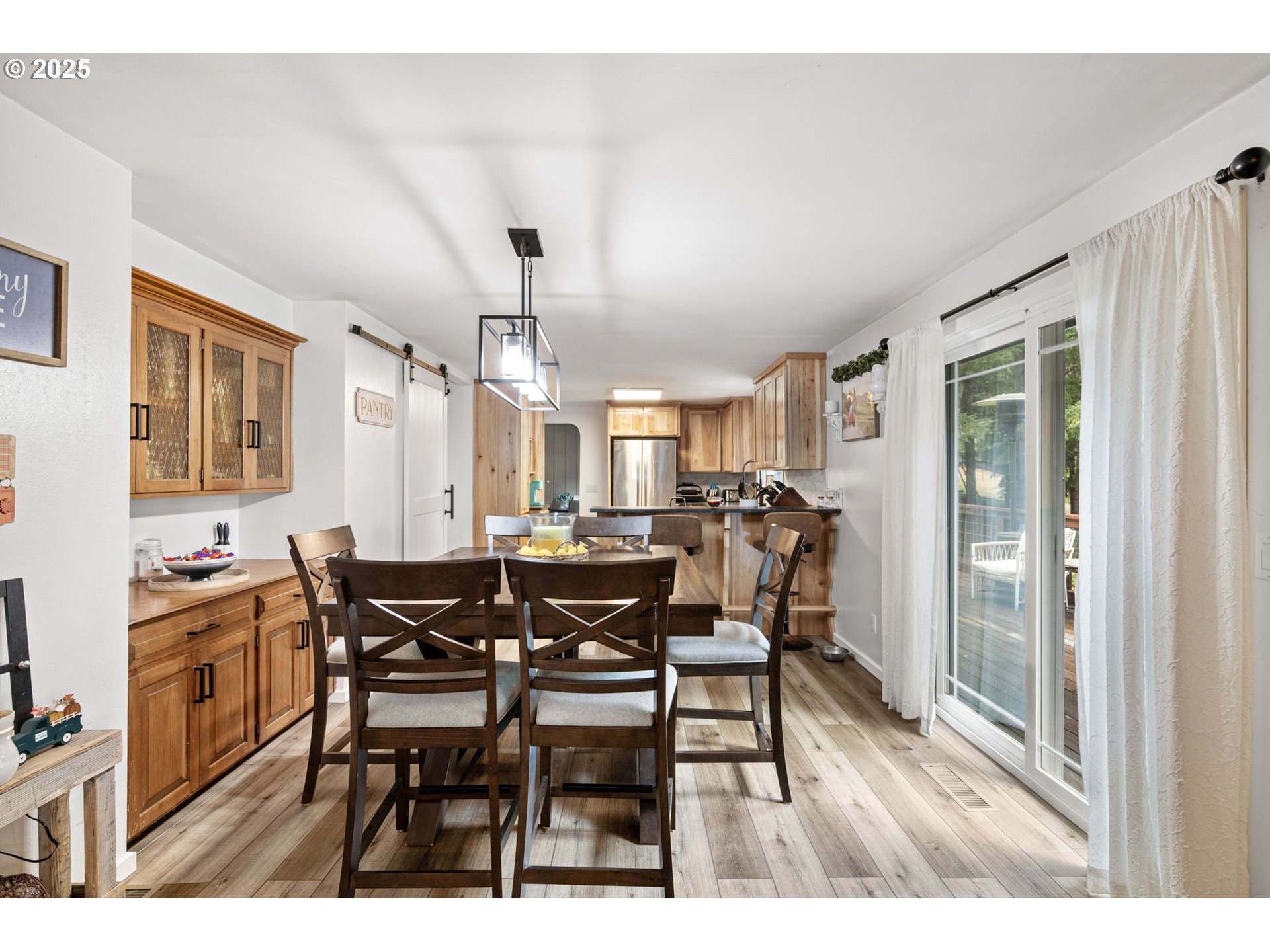 130 Tioga Court Cottage Grove, OR 97424 - Photo 24 of 44 a view of a dining room with furniture and chandelier