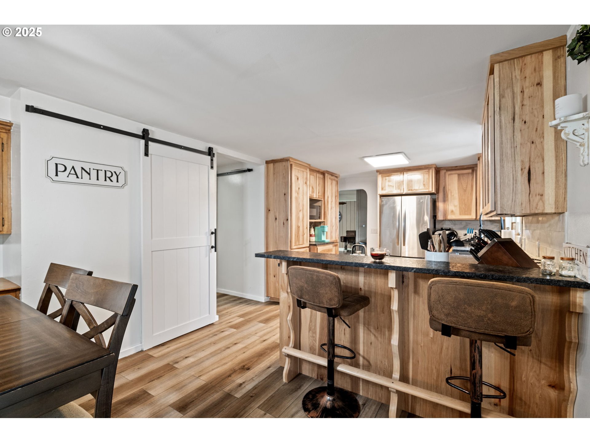 130 Tioga Court Cottage Grove, OR 97424 - Photo 26 of 44 a living room with furniture a large window and wooden floor