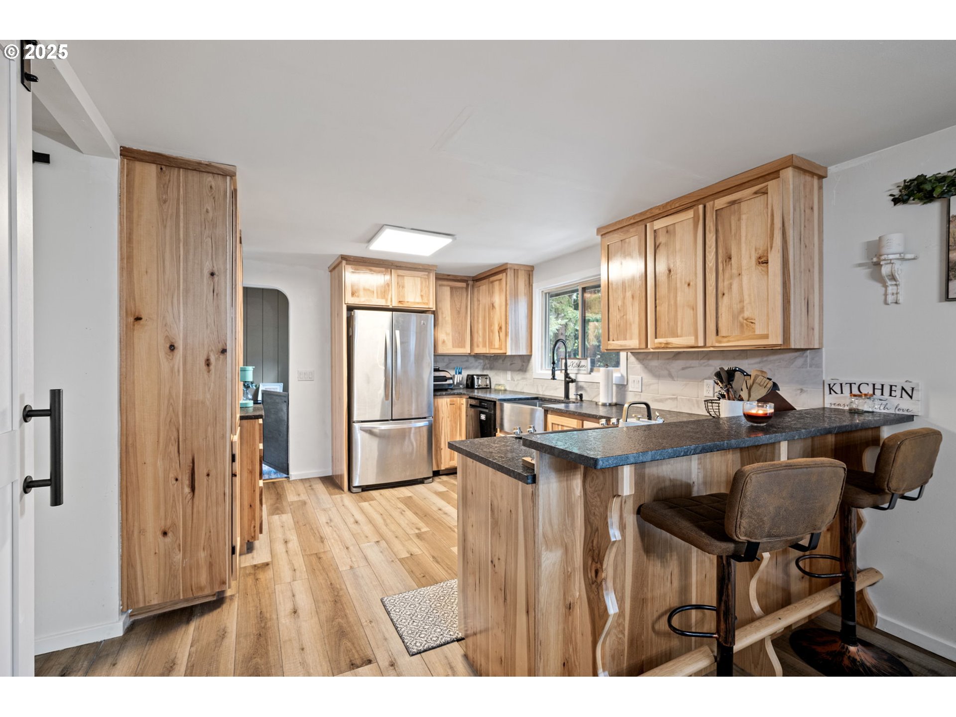 130 Tioga Court Cottage Grove, OR 97424 - Photo 28 of 44 a kitchen with kitchen island a sink table and chairs