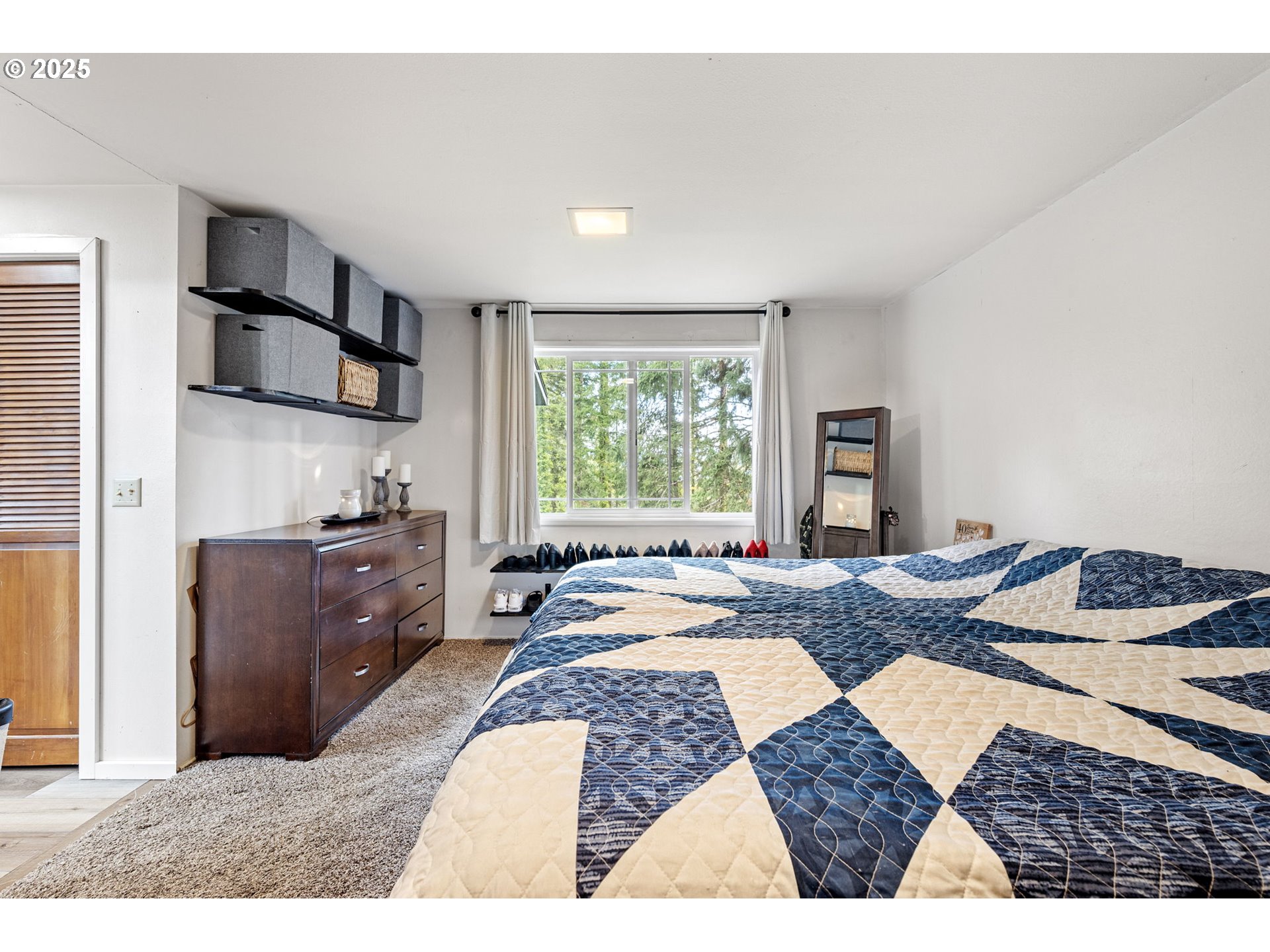 130 Tioga Court Cottage Grove, OR 97424 - Photo 36 of 44 a bedroom with a bed and wooden floor