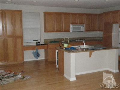 351 Spring Park Road Camarillo, CA 93012 - Photo 8 of 25 a kitchen with granite countertop a sink and a stove top oven