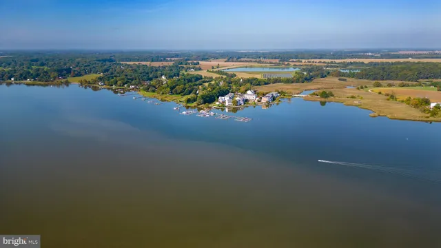 a view of a swimming pool with sitting area