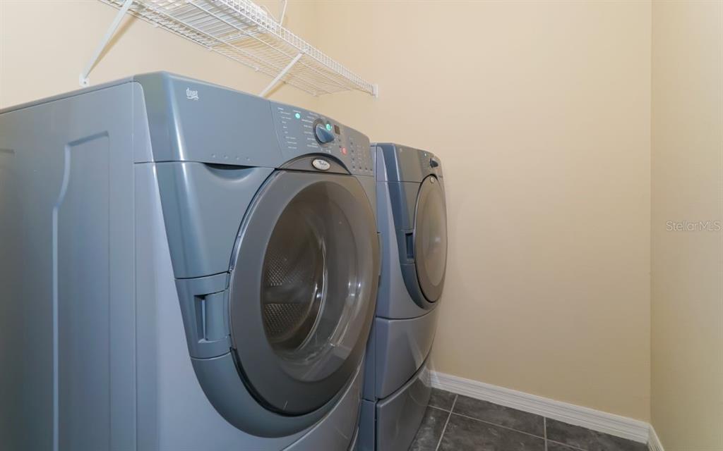 7339 Black Walnut Way Lakewood Ranch, FL 34202 - Photo 19 of 27 a close up view of a washer and dryer
