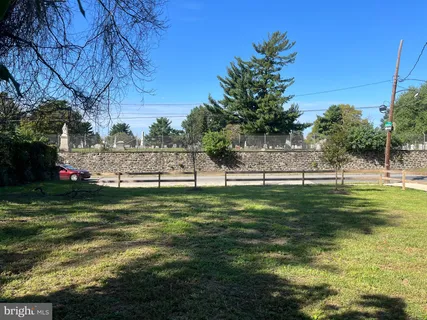 a view of a swimming pool with a yard