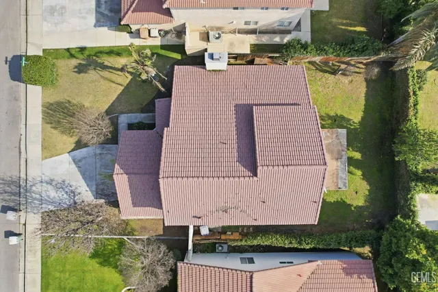 a front view of house with a garden