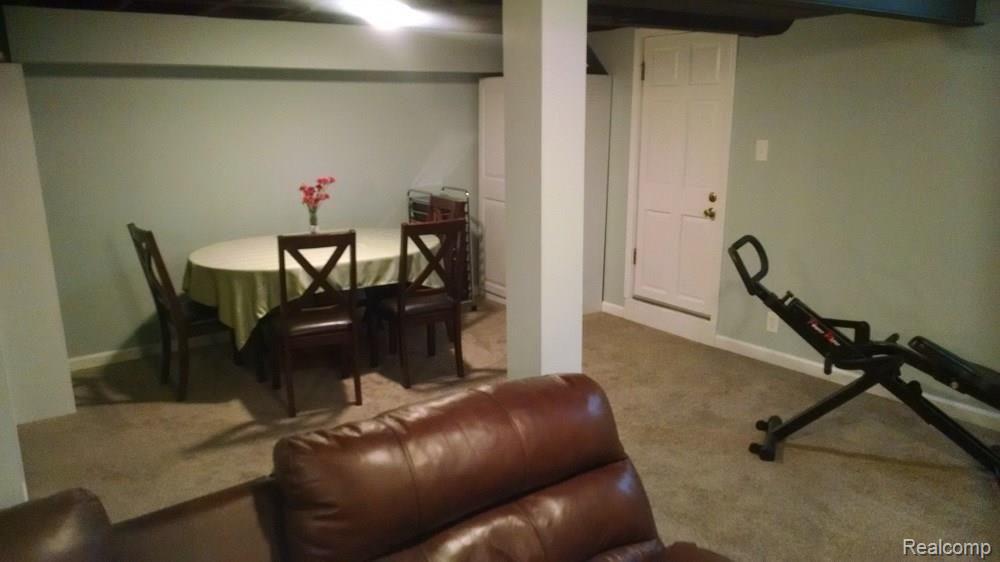 15714 Champaign Road Allen Park, MI 48101 - Photo 23 of 24 FINISHED BASEMENT REC ROOM. NOTE OUTSIDE EXIT DOOR IN BACKGROUND!