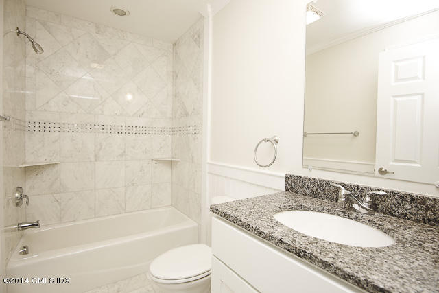 48 Valley Road Cos Cob, CT 06807 - Photo 21 of 33 a bathroom with a granite countertop sink mirror toilet and bathtub