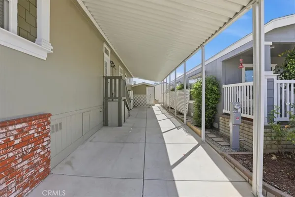 a view of a swimming pool with an outdoor seating and yard