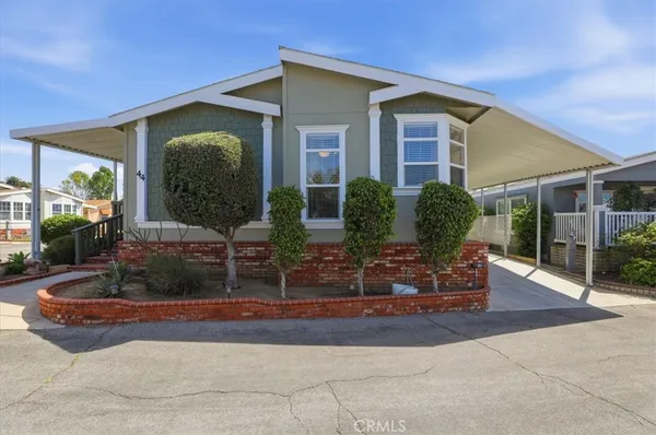 a view of house with yard
