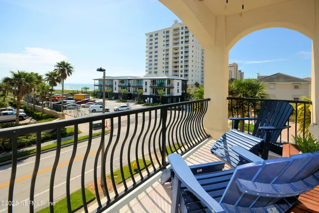 a view of a balcony with chairs