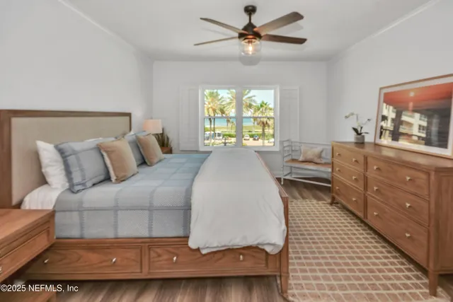 a living room with a bed furniture and a window