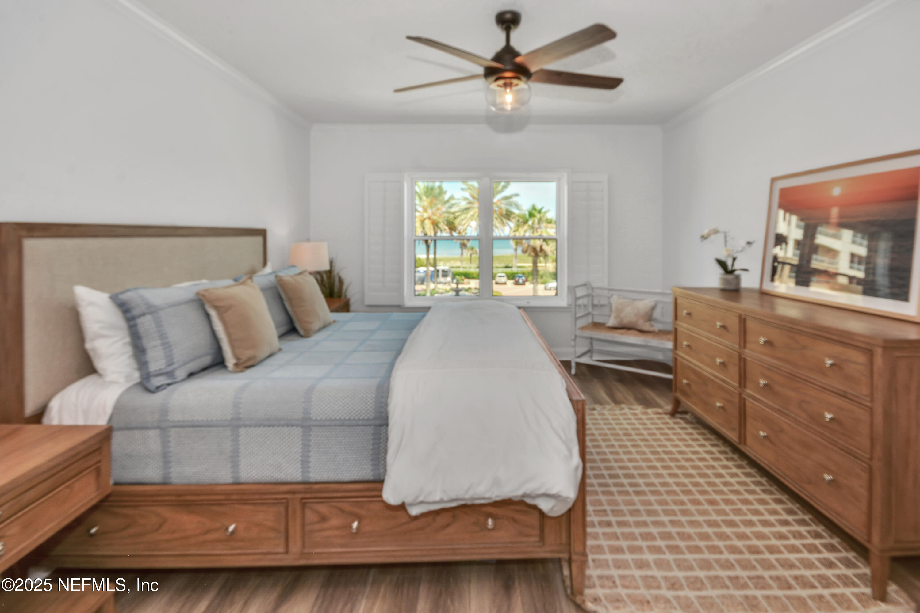 922 1st Street South, Unit 302 Jacksonville Beach, FL 32250 - Photo 16 of 28 a living room with a bed furniture and a window