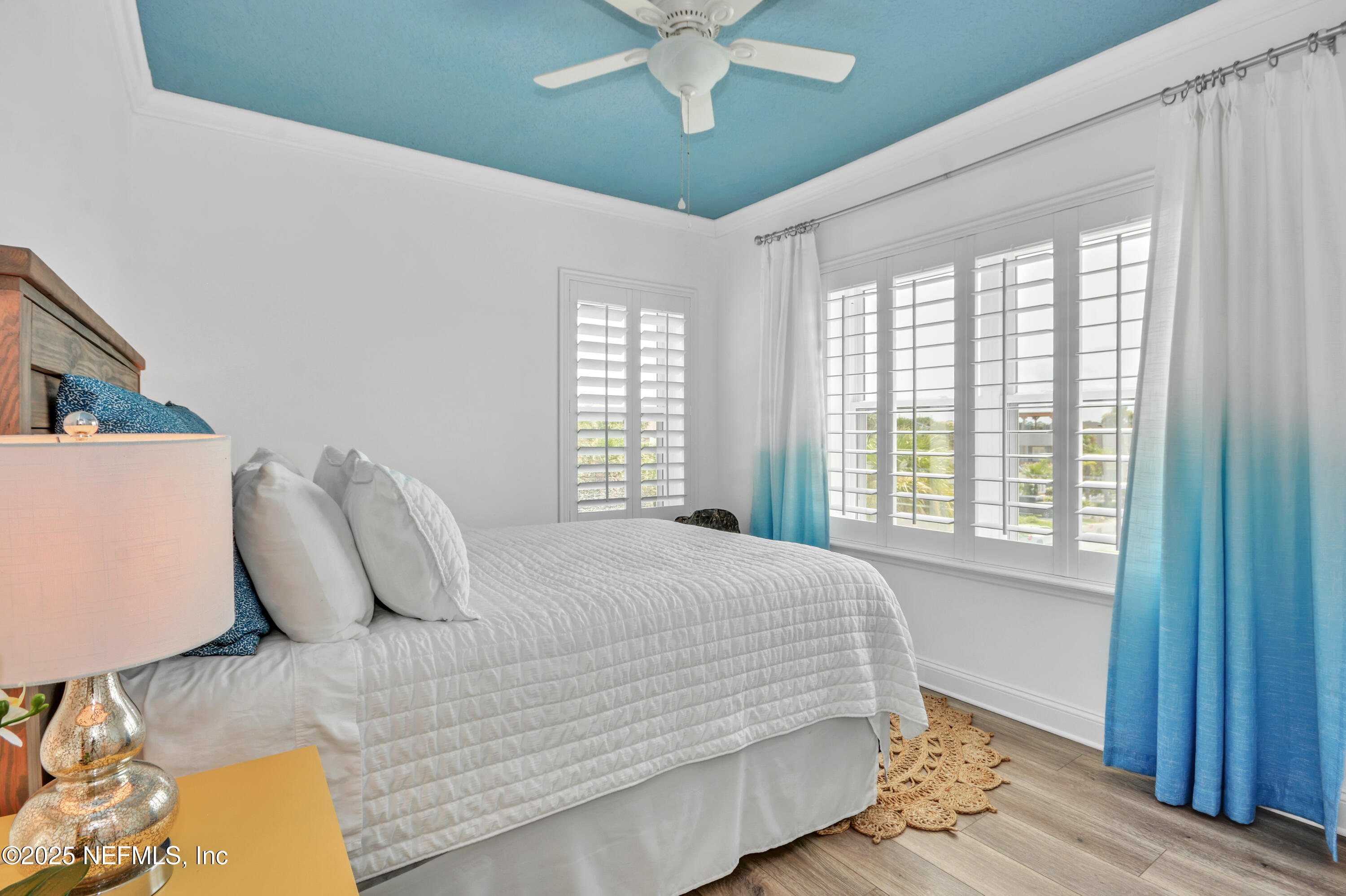 922 1st Street South, Unit 302 Jacksonville Beach, FL 32250 - Photo 24 of 28 a bedroom with a bed and window