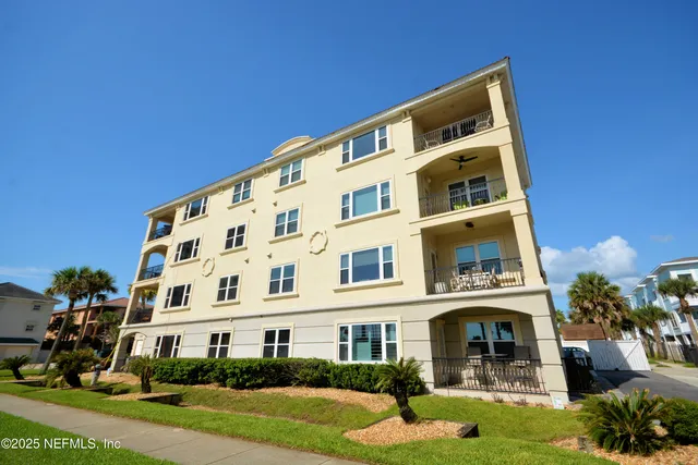 a view of a building with a yard