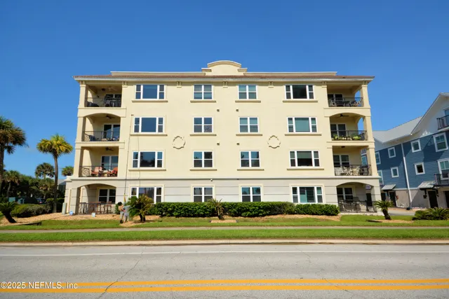 a view of a building with a yard
