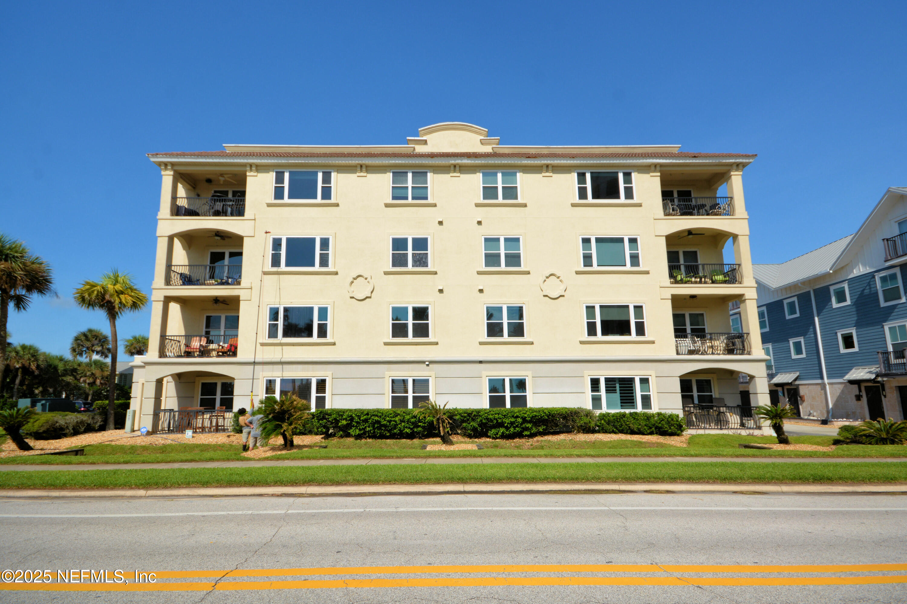922 1st Street South, Unit 302 Jacksonville Beach, FL 32250 - Photo 28 of 28 a view of a building with a yard