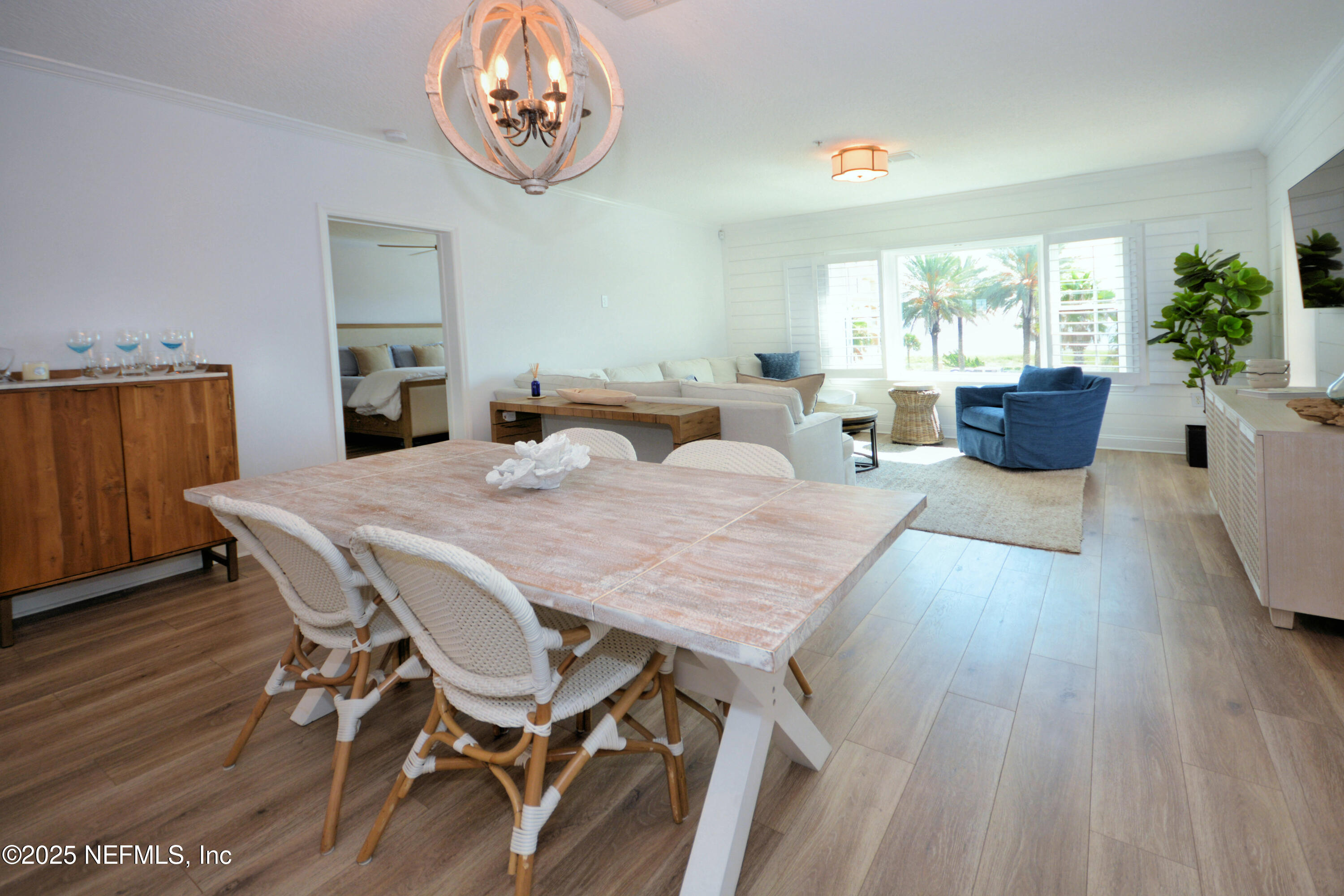 922 1st Street South, Unit 302 Jacksonville Beach, FL 32250 - Photo 7 of 28 a view of a dining room with furniture window and wooden floor