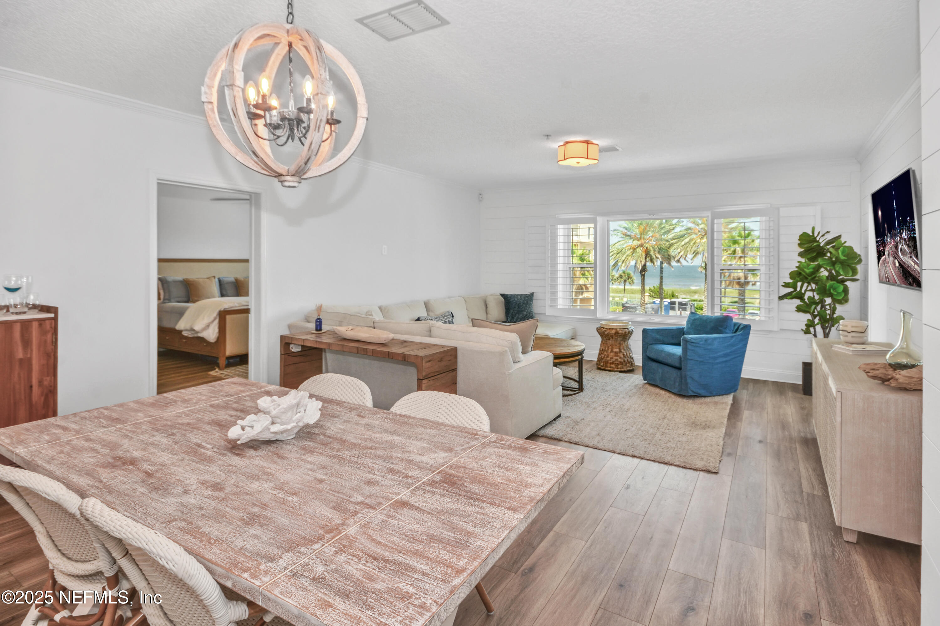 922 1st Street South, Unit 302 Jacksonville Beach, FL 32250 - Photo 8 of 28 a living room with furniture a window and a dining table