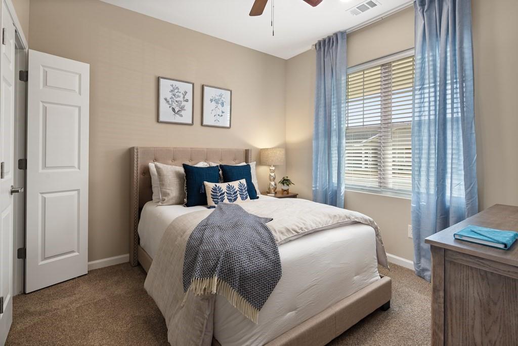 100 Harvest Grove Lane, Unit HAYES Calhoun, GA 30701 - Photo 14 of 16 a bedroom with a bed and a window