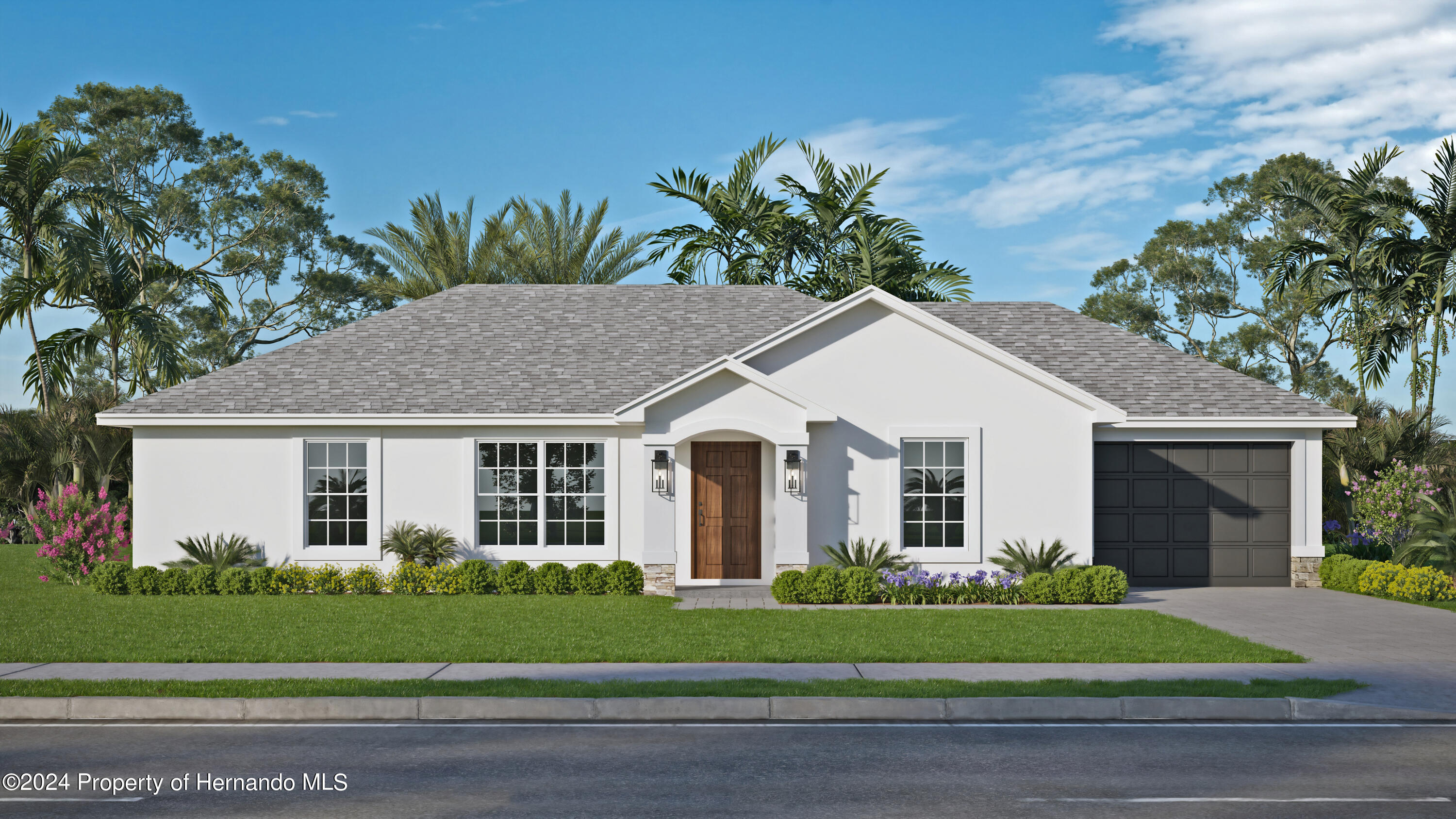 a front view of a house with a garden