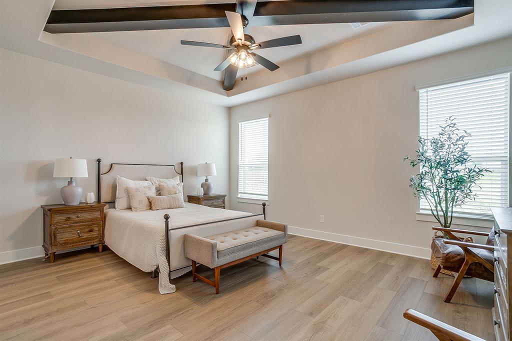 4511 Matador Rnch Road Waxahachie, TX 75165 - Photo 15 of 36 Tray ceiling with exposed wood-look beams and ceiling fan