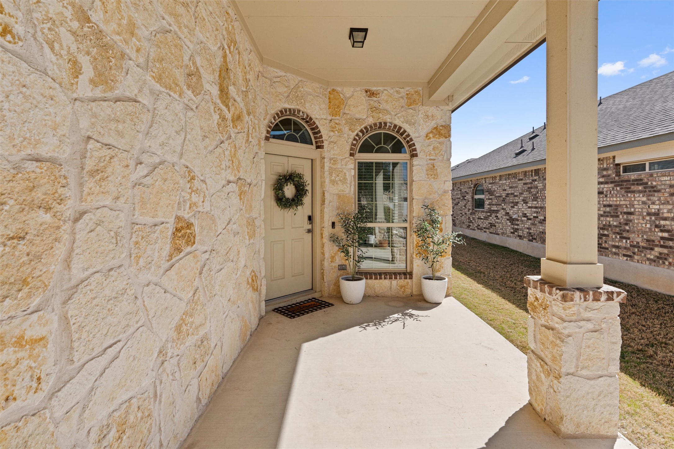 524 Longhorn Cavern Road Leander, TX 78641 - Photo 4 of 34 Entrance to property featuring a porch and stone siding