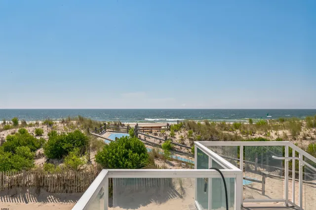 a view of a balcony with an ocean view