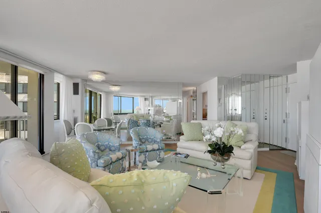 a living room with furniture potted plant and a window