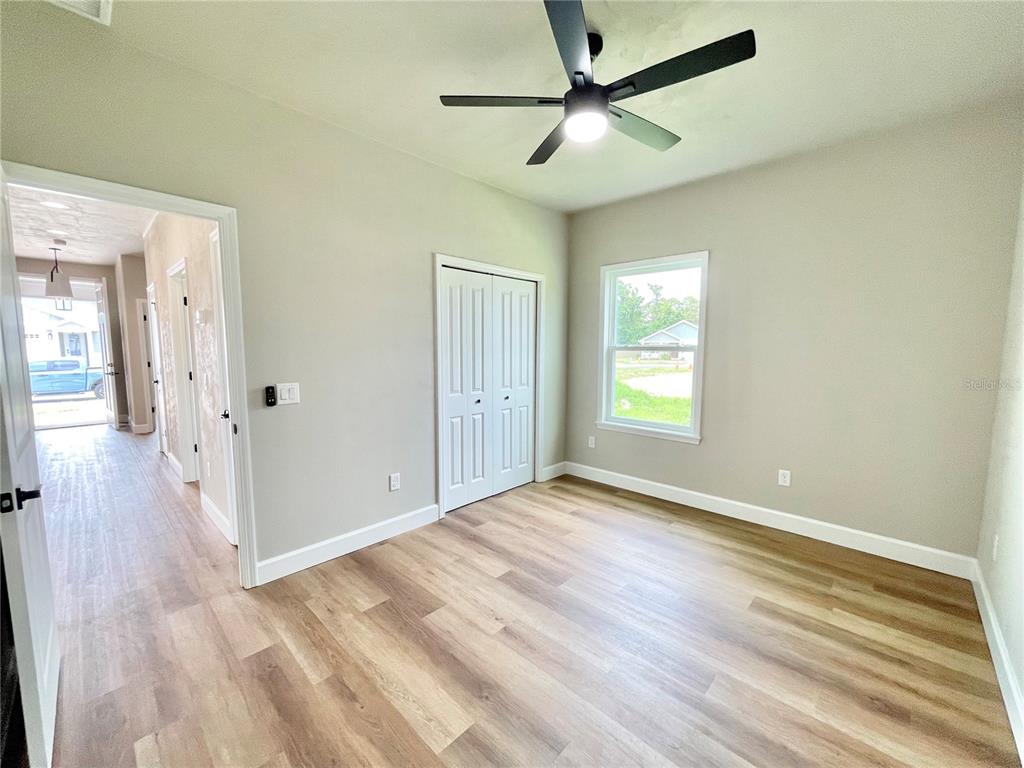 1021 Southwest 67th Street Gainesville, FL 32607 - Photo 23 of 53 wooden floor in an empty room with a window