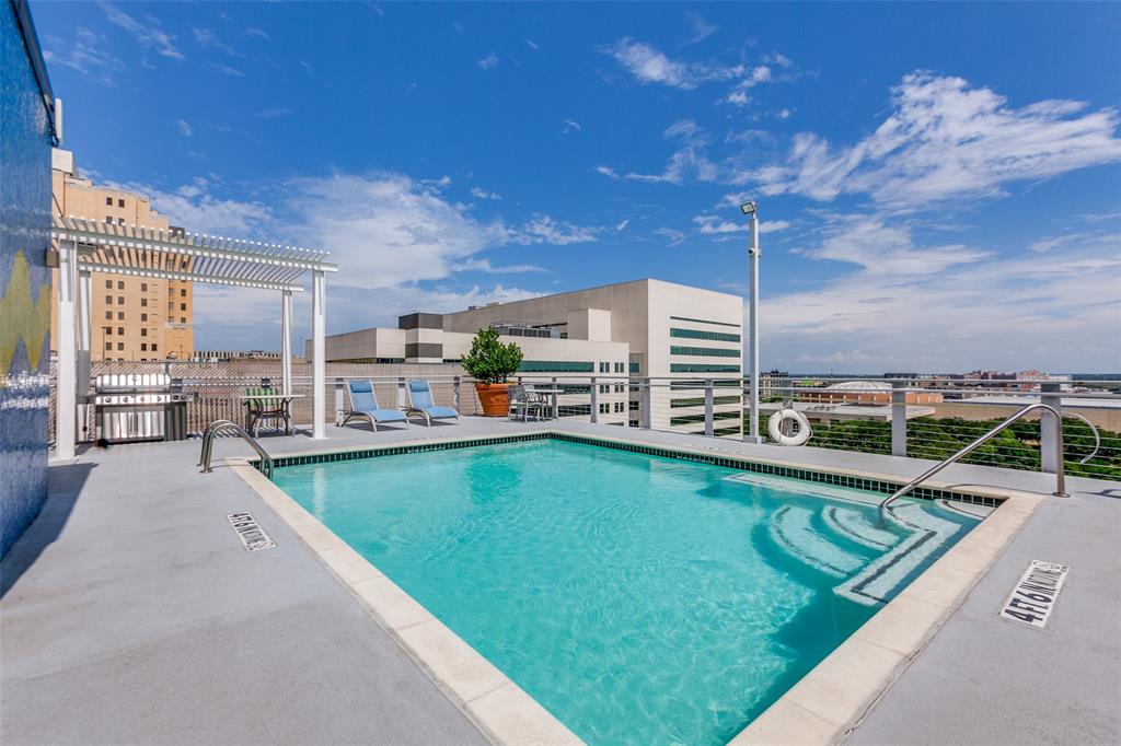 1122 Jackson Street, Unit 917 Dallas, TX 75202 - Photo 18 of 21 a swimming pool with outdoor seating and deck