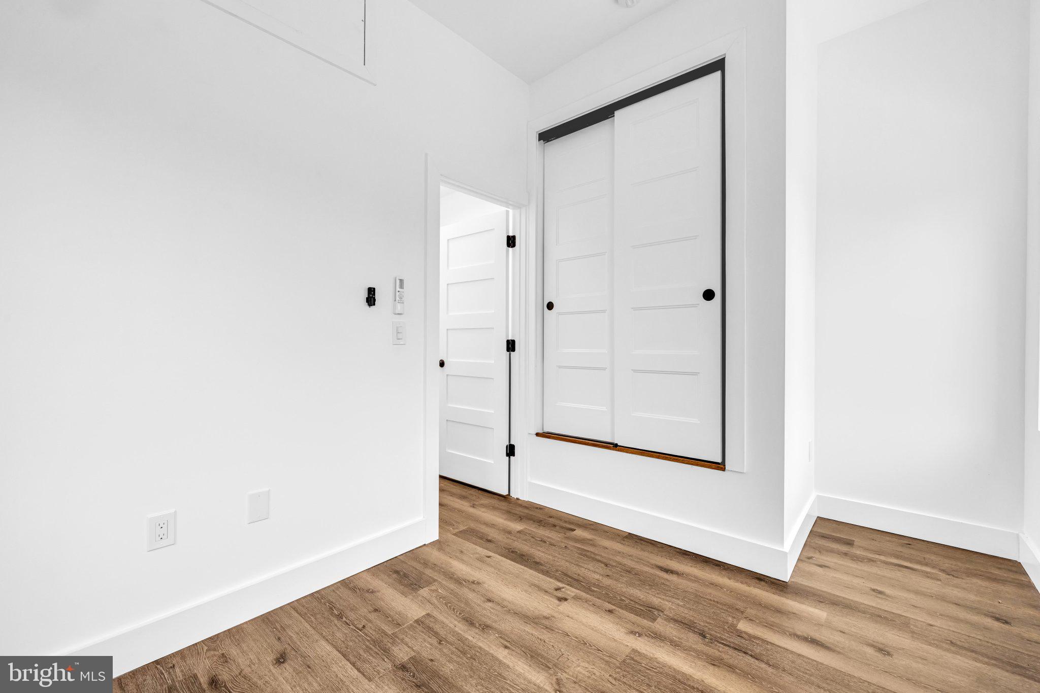2801 Round Road Baltimore, MD 21225 - Photo 14 of 29 a view of empty room with wooden floor