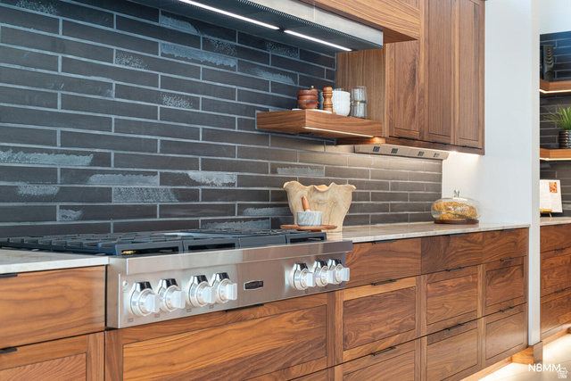 3607 South Cypress Pt Road Hurricane, UT 84737 - Photo 23 of 59 Kitchen view of wood finish cabinetry, tasteful backsplash, and stainless steel stovetop