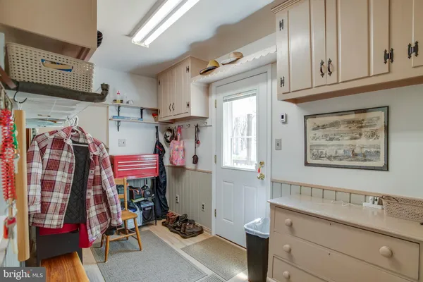 a view of a chairs and table in the backyard