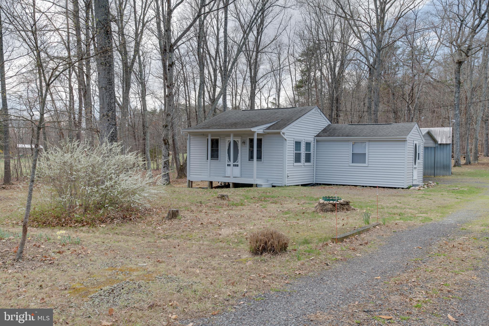 20174 Edwards Shop Road Elkwood, VA 22718 - Photo 20 of 54 a view of a house with large trees and wooden fence