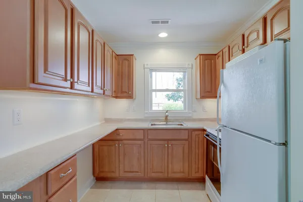 a backyard of apartments with large trees
