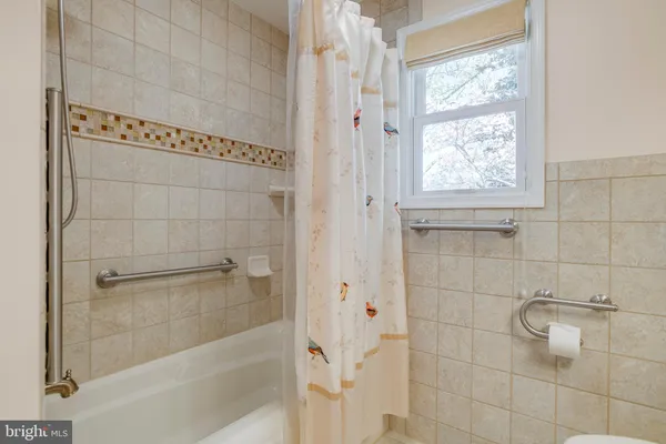 a view of swimming pool with a yard and green space