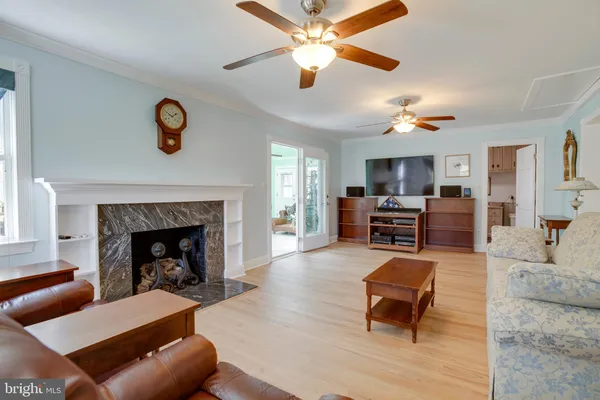 front view of a house with chairs and a table