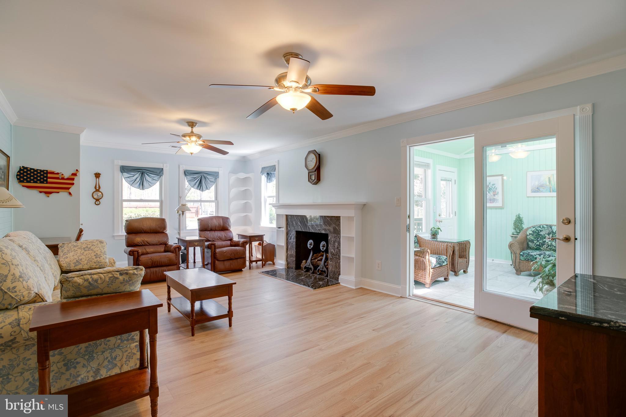 20174 Edwards Shop Road Elkwood, VA 22718 - Photo 6 of 92 a living room with furniture a fireplace and a dining table with wooden floor
