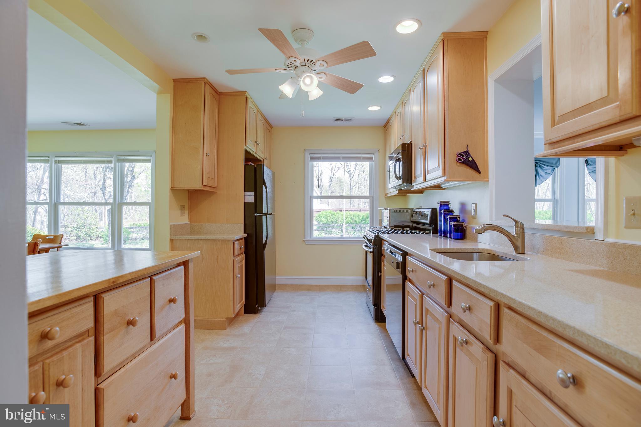 20174 Edwards Shop Road Elkwood, VA 22718 - Photo 9 of 92 a kitchen with stainless steel appliances granite countertop a sink and cabinets