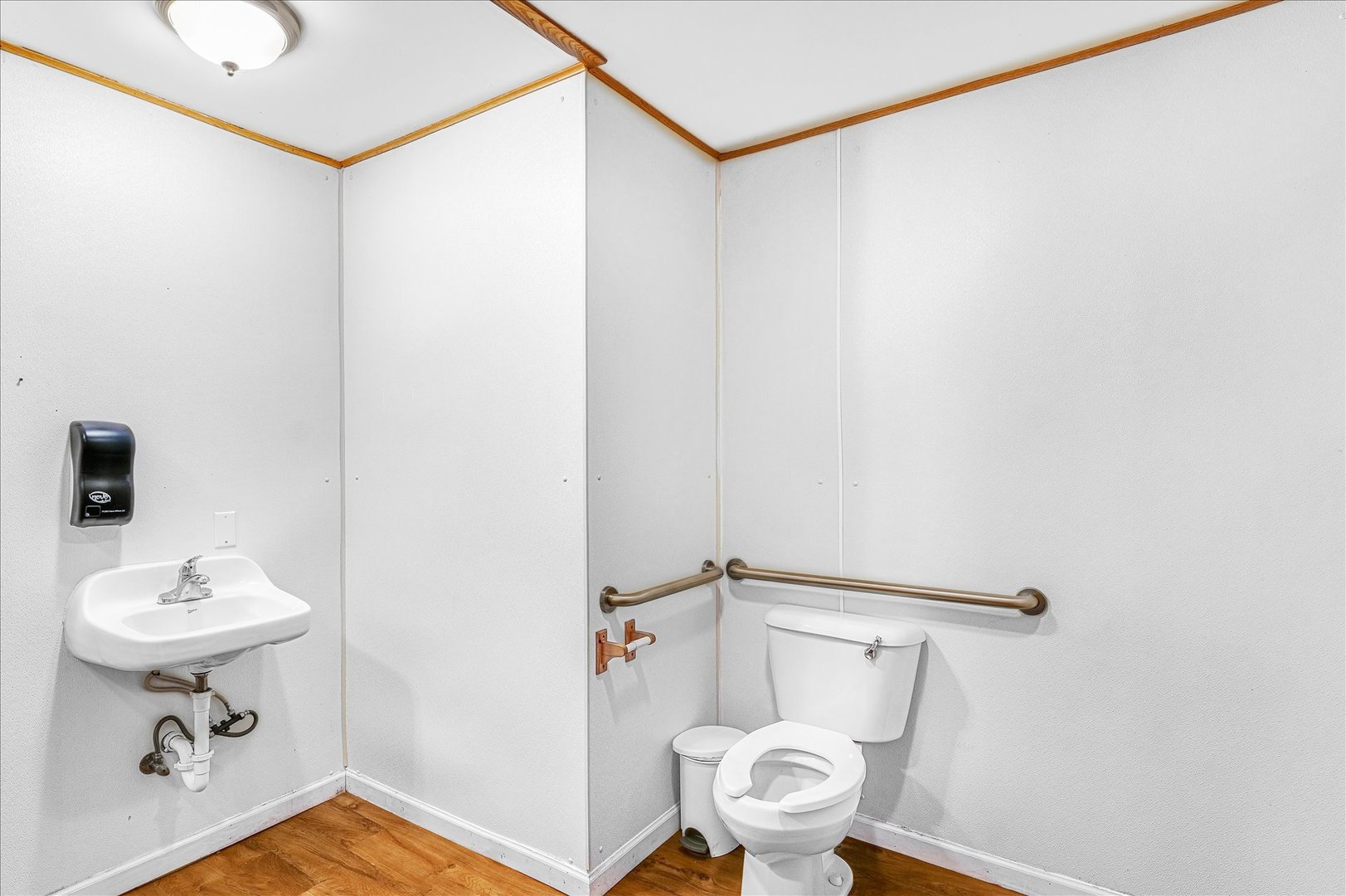 206 West Lincoln Street Saybrook, IL 61770 - Photo 15 of 28 a bathroom with a sink a toilet and mirror