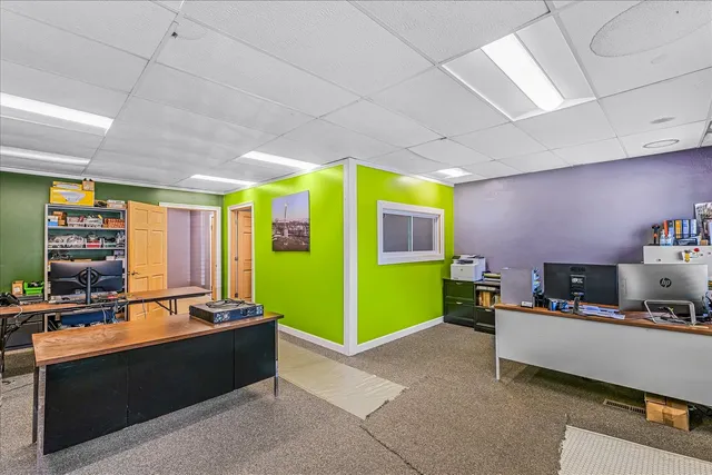 a kitchen with window and refrigerator