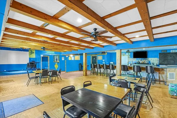 a dining room with lots of tables and chairs