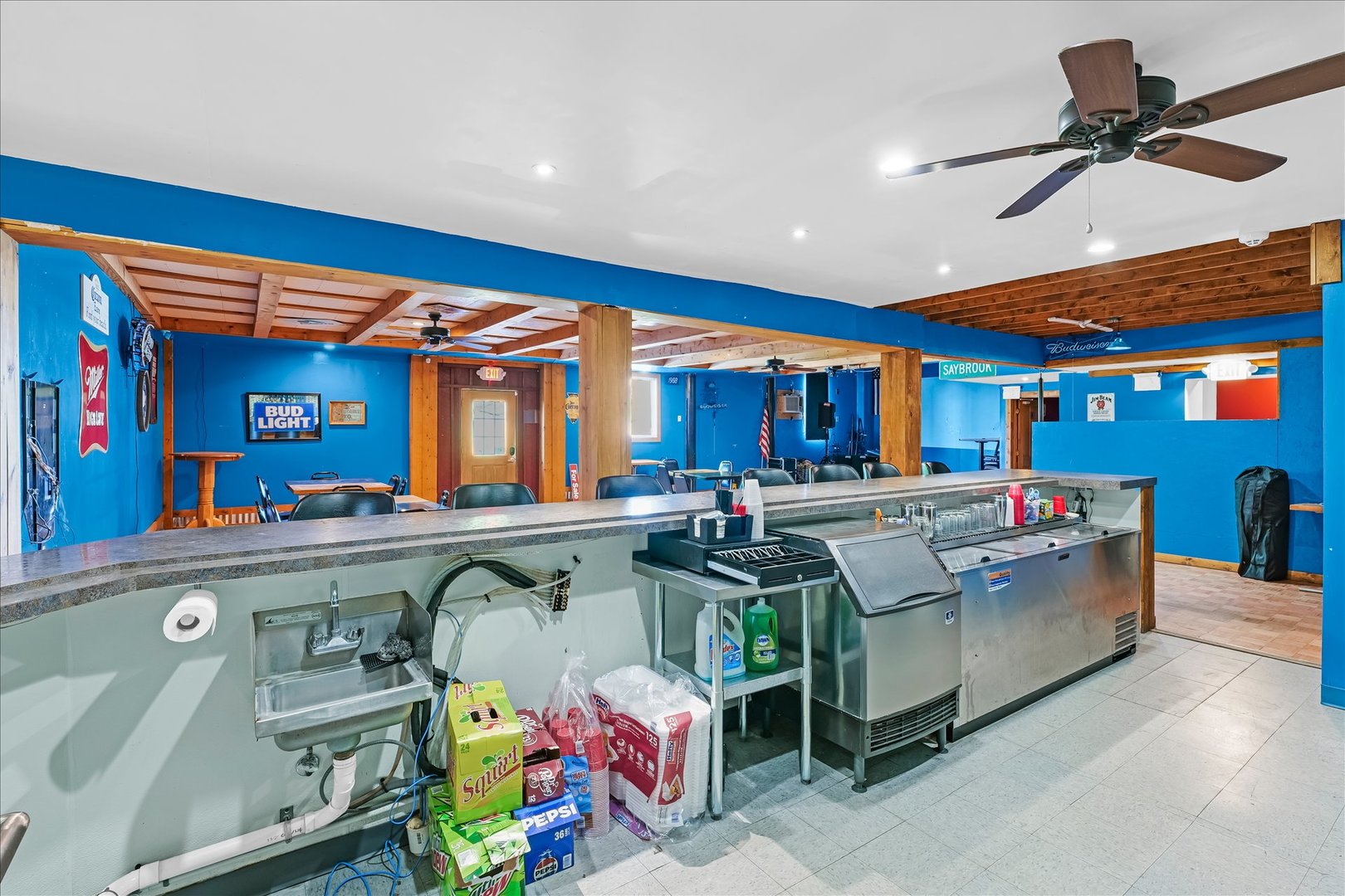 206 West Lincoln Street Saybrook, IL 61770 - Photo 9 of 28 a kitchen with a stove a microwave a dining table and chairs with wooden floor