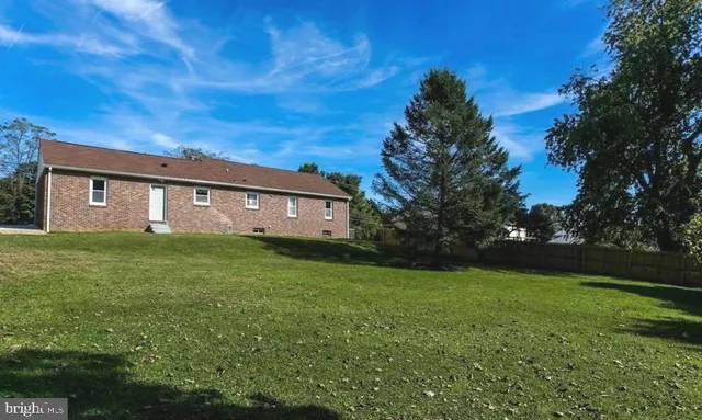 a front view of house with garden