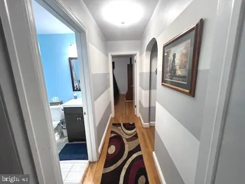 a view of an entryway with wooden floor