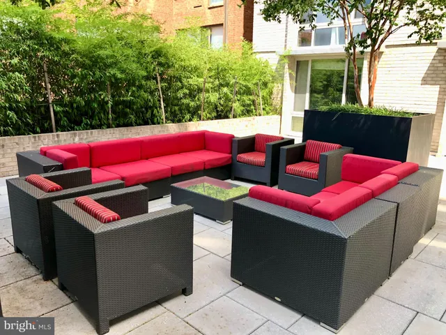 a view of a dinning tables and chairs in a patio
