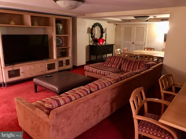 a kitchen with granite countertop stainless steel appliances a refrigerator a sink and cabinets