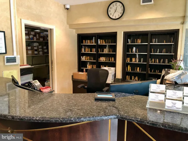 a view of a kitchen with granite countertop a sink and a stove
